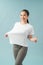 Successful weight loss, woman with too large t-shirt after a diet