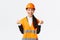 Successful winning asian female construction manager, engineer at building sight wearing safety helmet, raising hands in