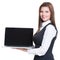Successful young business woman holding laptop.