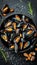 Succulent grilled mussels on elegant black plate a taste of classic mediterranean cuisine