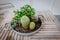 Succulent plants and cactus arrangement in a pan, beautiful ornamental setting, wooden table