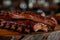 Succulent rack of barbecued pork ribs on wooden board. Meat food dinner close-up