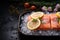 Succulent salmon fillets on ice, adorned with lemon and rose