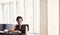 Sucessful black businesswoman looking into camera while seated at counter