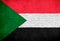Sudan flag painted on brick wall. National country flag background photo