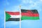 Sudan and Malawi two flags on flagpoles and blue sky