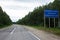 Sudden harsh difference and contrast between a good and bad weathered damaged road at Vladimir Okrug border. Sign says in Russian