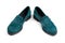 Suede dark green women`s slip-on shoes with a small heel. Close-up shot