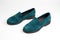 Suede dark green women's slip-on shoes with a small heel. Close-up shot