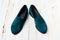 Suede dark green women`s slip-on shoes with a small heel. Close-up shot