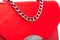 Suede handbag red color with chain.