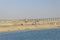 Suez Canal, Egypt - Mar 27 2013: War memorial North side of Al Salam bridge, seen onboard from a vessel transiting the Suez Canal