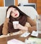 Suffering girl with medications at table