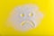 Sugar is bad. Sad sugar face on the yellow background.