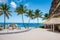 Sugar beach Saint Lucia , a public white tropical beach with palm trees and luxury beach chairs on the beach of the