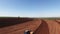 Sugar cane aerial video - Mechanized planting sugar cane field in Sao Paulo Brazil - Aerial dolly out over tractor and truck