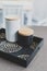 Sugar and coffee canisters on boho breakfast tray, concept of organised minimalist kitchen