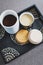 Sugar and coffee canisters on boho breakfast tray, concept of organised minimalist kitchen