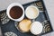 Sugar and coffee canisters on boho breakfast tray, concept of organised minimalist kitchen