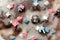 Sugar colored confetti lies on a white icing cupcake, texture of sugar icing on a cupcake surface close-up, pink, blue and white