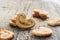 Sugar cookie curls with poppy seed puff pastry on wooden background. Confectionery for the recipe. Pastries, dessert