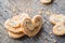 Sugar cookie curls with poppy seed puff pastry on wooden background. Confectionery for the recipe. Pastries, dessert