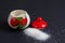 Sugar explosion in a sugar bowl with strawberries on a black background