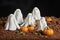 Sugar paste scene of halloween, group of ghosts in a pumpkin patch