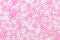 Sugar pearls background, colored white and pink, concept bakery