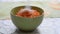 Sugar is poured into a bowl with grated carrots. Cooking concept