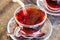 Sugar poured in traditional turkish tea in glass