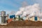 Sugar production factory with beets in the foreground