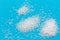 Sugar scattered on a bright blue background