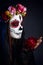 Sugar skull makeup girl with rose