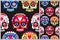 Sugar skulls on black seamless patterns