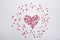 Sugar Sprinkles Candies in Heart Shape Scattered on White Background. Valentine Romance Birthday Charity Symbol.