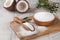 Sugar substitute in a wooden bowl on a background of coconut. Natural sweetener. Stevia, erythritol.