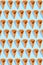 Sugar waffle cone for ice cream arranged in pattern on mint background. The image with copy space can be used as a