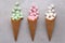 Sugar Waffle Ice Cream Cones filled with colorful marshmallows spilling onto tile table