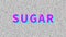 Sugar. Word about food problem on noisy old screen. Looping VHS interference. Vintage animated background. 4K video