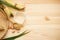 Sugarcane, fresh cane juice and brown sugar on a wooden background, space for text. Top view