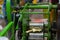 Sugarcane juice pressing machine is extracting juice from sugarcane sticks in traditional method. This is a very popular