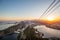 Sugarloaf mountain in Rio de Janeiro at sunset with view over city & Guanabara bay & cable car of tourists in Brazil South America