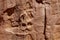 A suggestion of faces in the weathered patterns of a rock wall in the Grand Staircase-Escalante National Monument, Utah, USA
