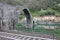 The suggestive and famous Ponte del Diavolo of Lucca built in bricks over a river in an ancient medieval village in Borgo a