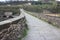 The suggestive and famous Ponte del Diavolo of Lucca built in bricks over a river in an ancient medieval village in Borgo a