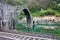 The suggestive and famous Ponte del Diavolo of Lucca built in bricks over a river in an ancient medieval village in Borgo a