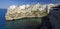 Suggestive landscape view on dramatic cliffs with caves rising from Adriatic sea in Polignano a Mare