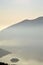 An suggestive view of Lake Iseo at sunset with the fog