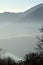 An suggestive view of Lake Iseo at sunset with the fog